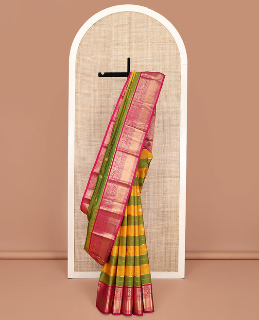Green-Yellow Vasundhara Silk Saree, Embellished with Zari Buttas and Zari Stripes All Over Its Body, Complemented by a Contrast Border of Thilakam Mokku, Banaras, Muthu, and Kodi Visiry Designs, Pallu of Vanki Designs, and Paired with a Contrast Blouse
