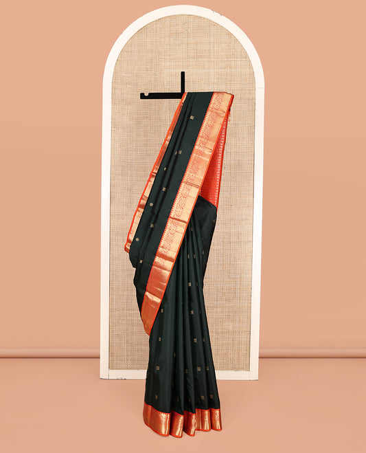 Green Vasundhara Silk Saree, Accentuated with Zari Buttas, Contrast Traditional Zari Border, Grand Pallu, and a Contrast Blouse