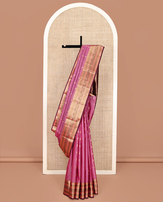 Pink Vasundhara Silk Mix Saree, Embellished with Zari Buttas All Over Its Body, Complemented by Captivating Contrast Border of Rekku, Mayil Kann, Kodi Manga, and Kodi Visiry Designs, Grand Jaal Pallu and Paired with a Contrast Blouse