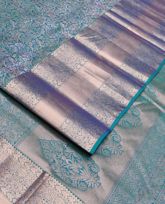 Blue jacquard Kanchipuram wedding silk saree, zari border of rekku, muthu, manga, and mayil kan designs, and intricate zari pallu