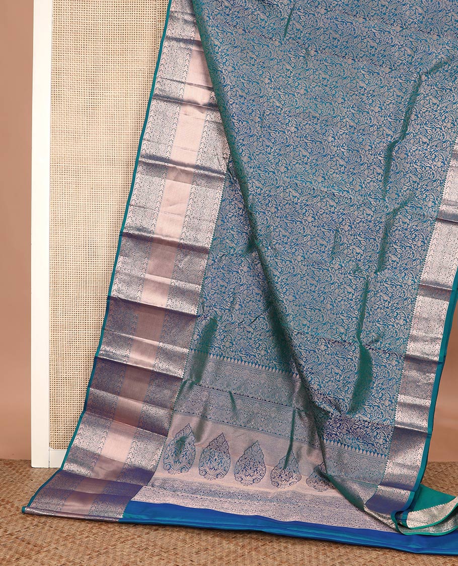 Blue jacquard Kanchipuram wedding silk saree, zari border of rekku, muthu, manga, and mayil kan designs, and intricate zari pallu