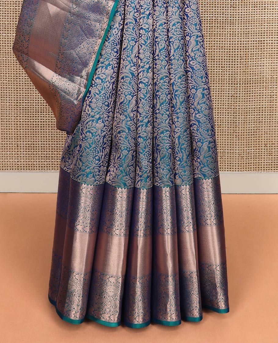 Blue jacquard Kanchipuram wedding silk saree, zari border of rekku, muthu, manga, and mayil kan designs, and intricate zari pallu
