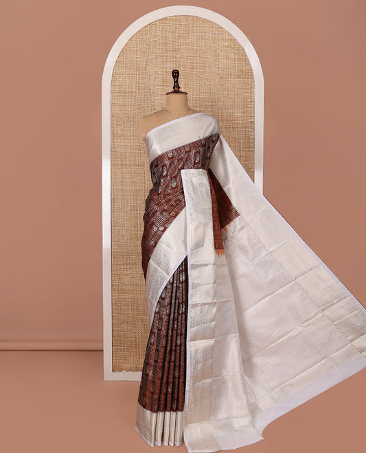 Brown Budget Silk Saree, Ornamented with Peacock and Elephant Motif Enclosed Checks, Complemented by a Contrast Traditional Zari Designs Woven Border, Pallu of Jaal Designs, and Paired with a Contrast Blouse