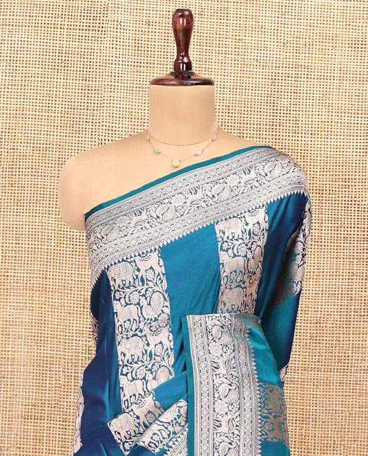 Blue Banarasi Silk Saree, Majestically Detailed with Floral and Animal Motifs on Its Body, Highlighted by a Self-Border of Traditional Designs, Pallu of Stripes, and Paired with a Matching Blouse