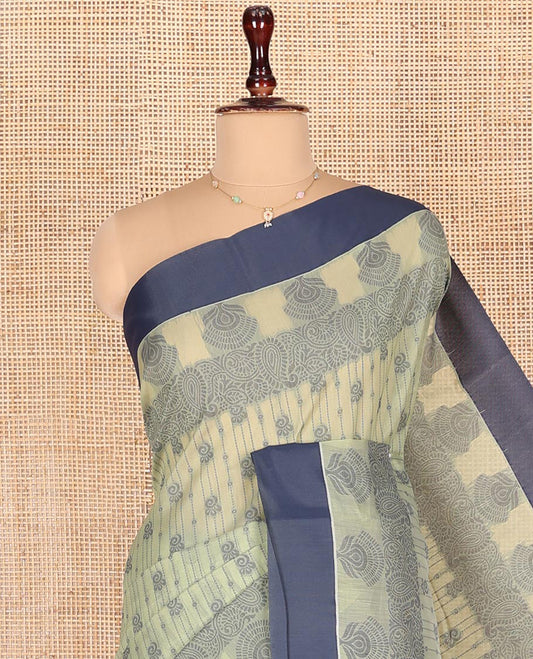 Pastel Green Semi-Silk Cotton Saree, Sparsely Woven with Floral Designs All Over Its Body, Complemented by Contrast Border, Sparsely Woven Pallu of Intricate Designs, and Paired with a Matching Blouse