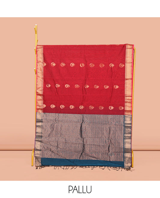 Red Semi-Silk Cotton Saree, Ornamented with Zari Buttas All Over Its Body, Highlighted by a Traditional Zari Border, Intricately Designed Pallu, and Paired with a Contrast Blouse