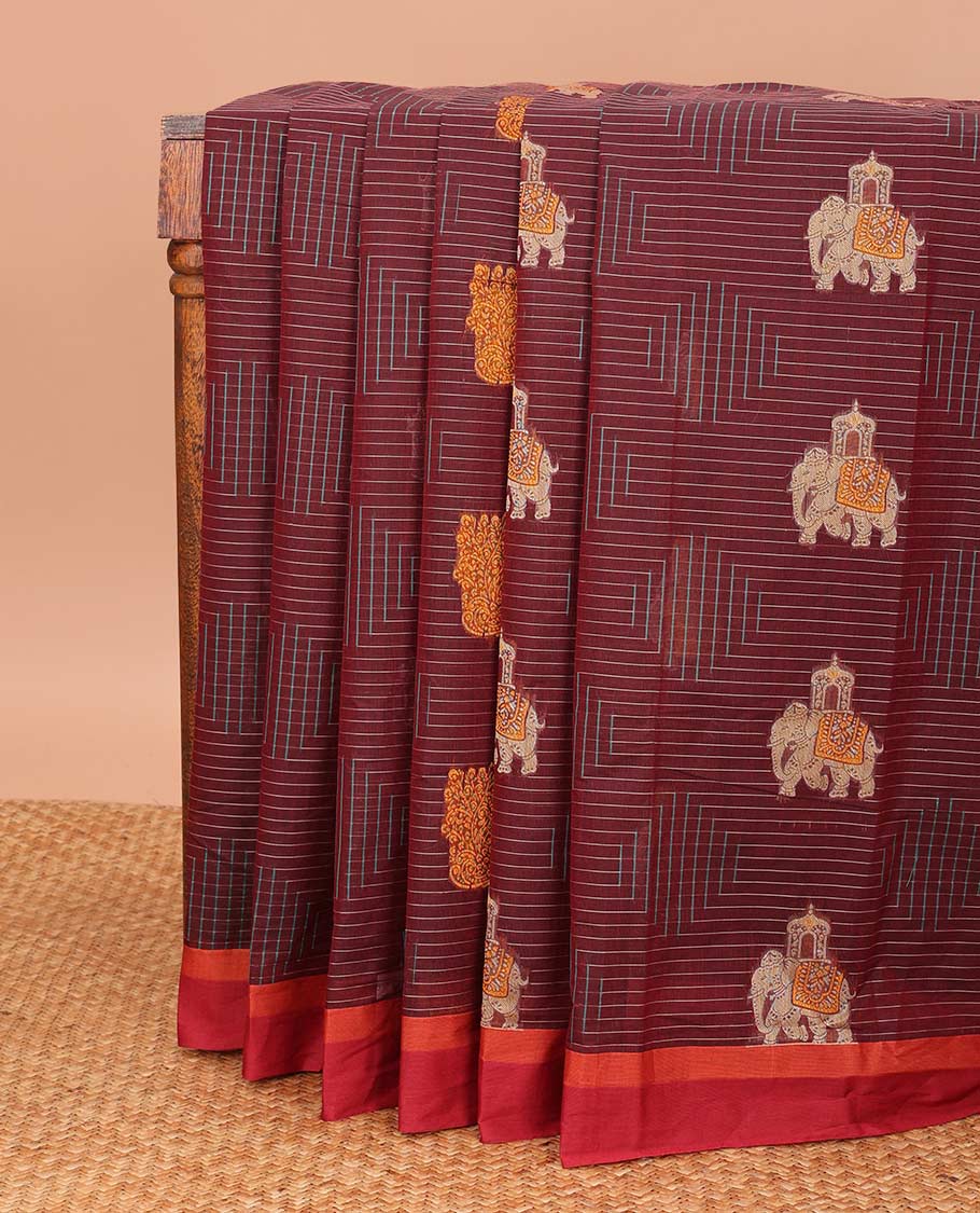 Maroon geometric and animal motifs printed Coimbatore cotton saree, contrast border, and pallu of elephant, peacock and leaf motifs