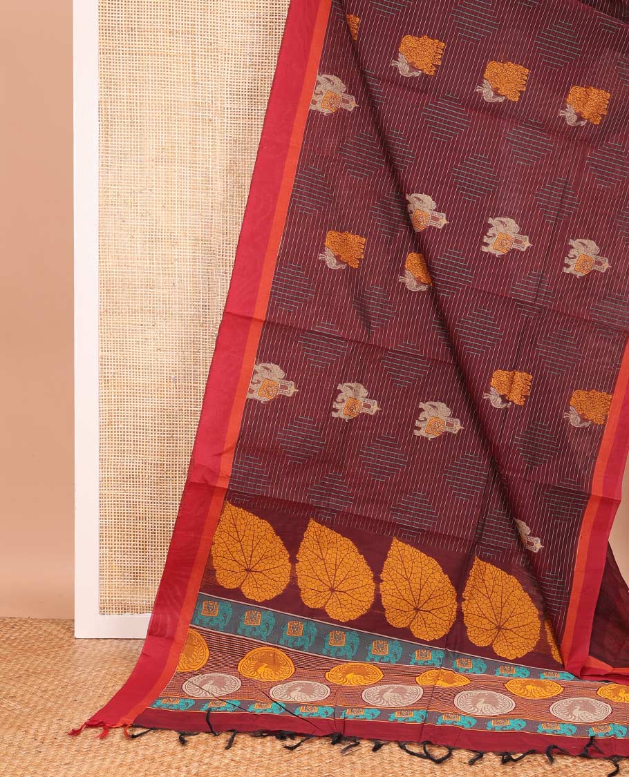 Maroon geometric and animal motifs printed Coimbatore cotton saree, contrast border, and pallu of elephant, peacock and leaf motifs
