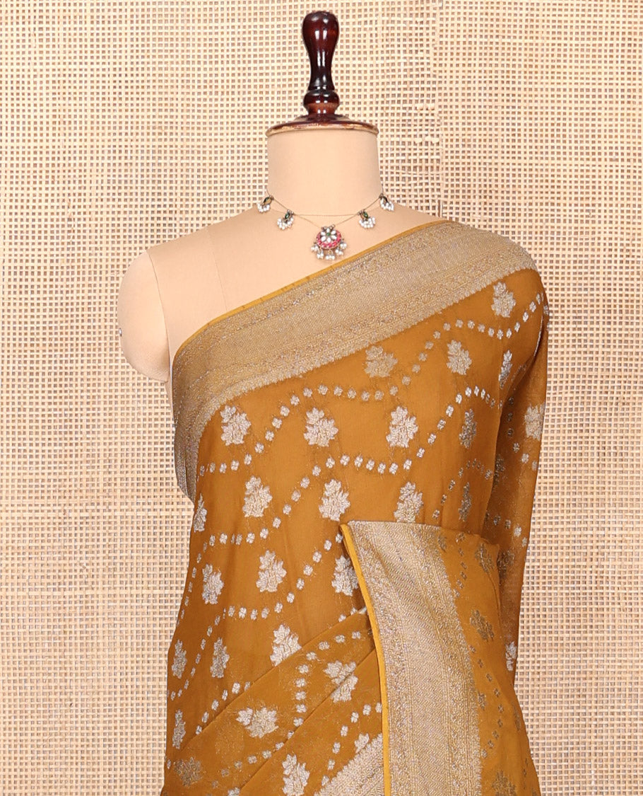 Mustard Georgette Saree, Adorned with Buttas and Stripes, Highlighted by a Traditional Border, Intricately Designed Pallu, and a Matching Blouse