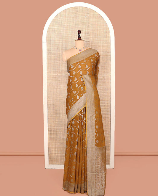 Mustard Georgette Saree, Adorned with Buttas and Stripes, Highlighted by a Traditional Border, Intricately Designed Pallu, and a Matching Blouse