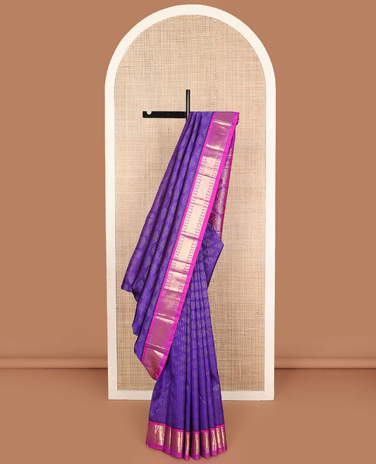 Violet zari buttas Kanchipuram silk saree, contrast one-sided border of laddu kamalam, and mayil kann designs, and intricate pallu