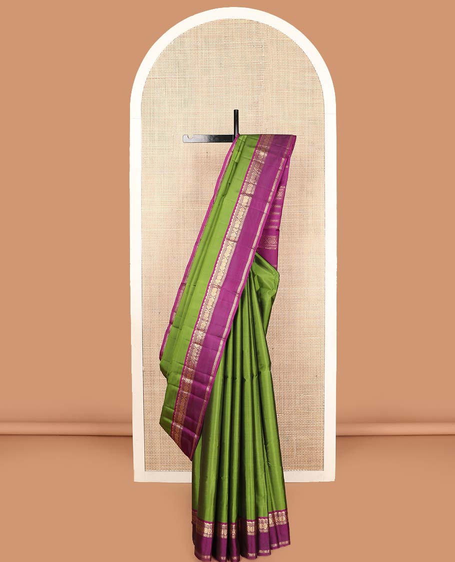Green zari buttas Kanchipuram silk saree, contrast rettai pettu border and pallu of rekku, muthu, neli, and jadai nagam designs