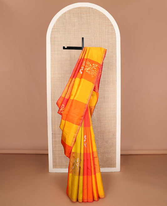 Multi-colored bird buttas enclosed macro-checked Kanchipuram silk saree, striped piping border, and zari-rich pallu