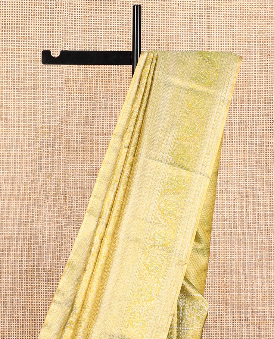 Green Kanchipuram Tissue Silk Saree, Detailed with Jacquard Design on Its Body, Highlighted by a Zari Border of Kathir, Mayil Kann, and Dhavana Kodi Designs, Gracefully Embellished Pallu, and Paired with a Matching Blouse