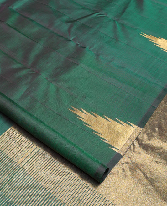 Green plain Kanchipuram silk saree, gleaming antique golden zari colored thazampoo rekku border, and zari-rich pallu of seppu rekku design