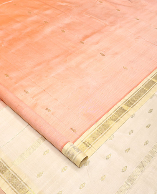 Peach Kanchipuram Silk Saree, Detailed with Zari Buttas All Over Its Body, Complemented by a Contrast One-Sided Border of Banaras, and Mayil Kann Designs, Pallu of Zari Designs, and Comes Without a Blouse
