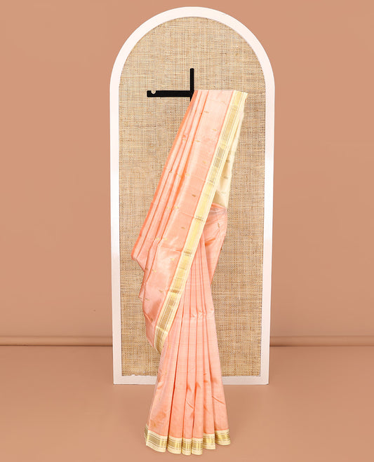 Peach Kanchipuram Silk Saree, Detailed with Zari Buttas All Over Its Body, Complemented by a Contrast One-Sided Border of Banaras, and Mayil Kann Designs, Pallu of Zari Designs, and Comes Without a Blouse