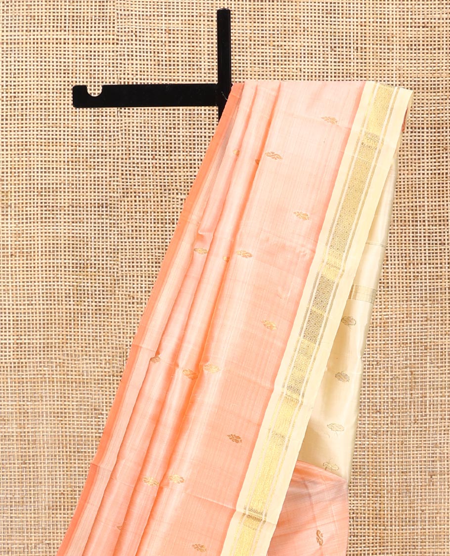 Peach Kanchipuram Silk Saree, Detailed with Zari Buttas All Over Its Body, Complemented by a Contrast One-Sided Border of Banaras, and Mayil Kann Designs, Pallu of Zari Designs, and Comes Without a Blouse