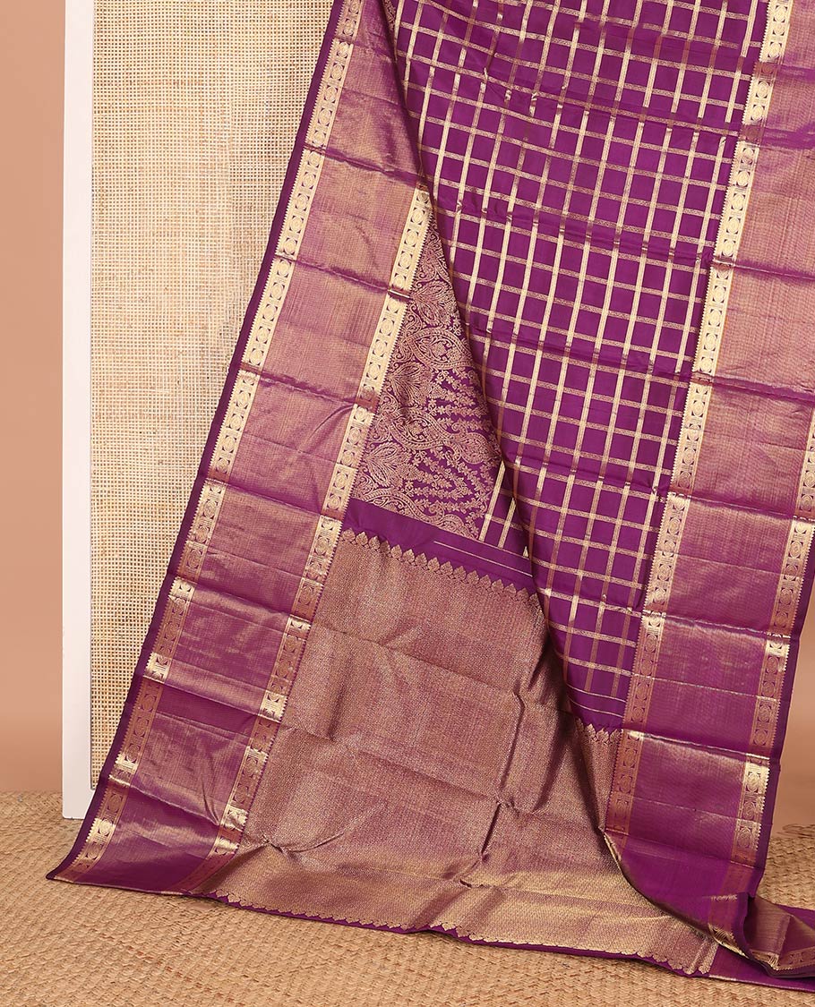 Purple thick zari checked with Mughal buttas designer saree, rettai pettu border of thilakam mokku, muthu, and chakram designs, and mayil kann design pallu