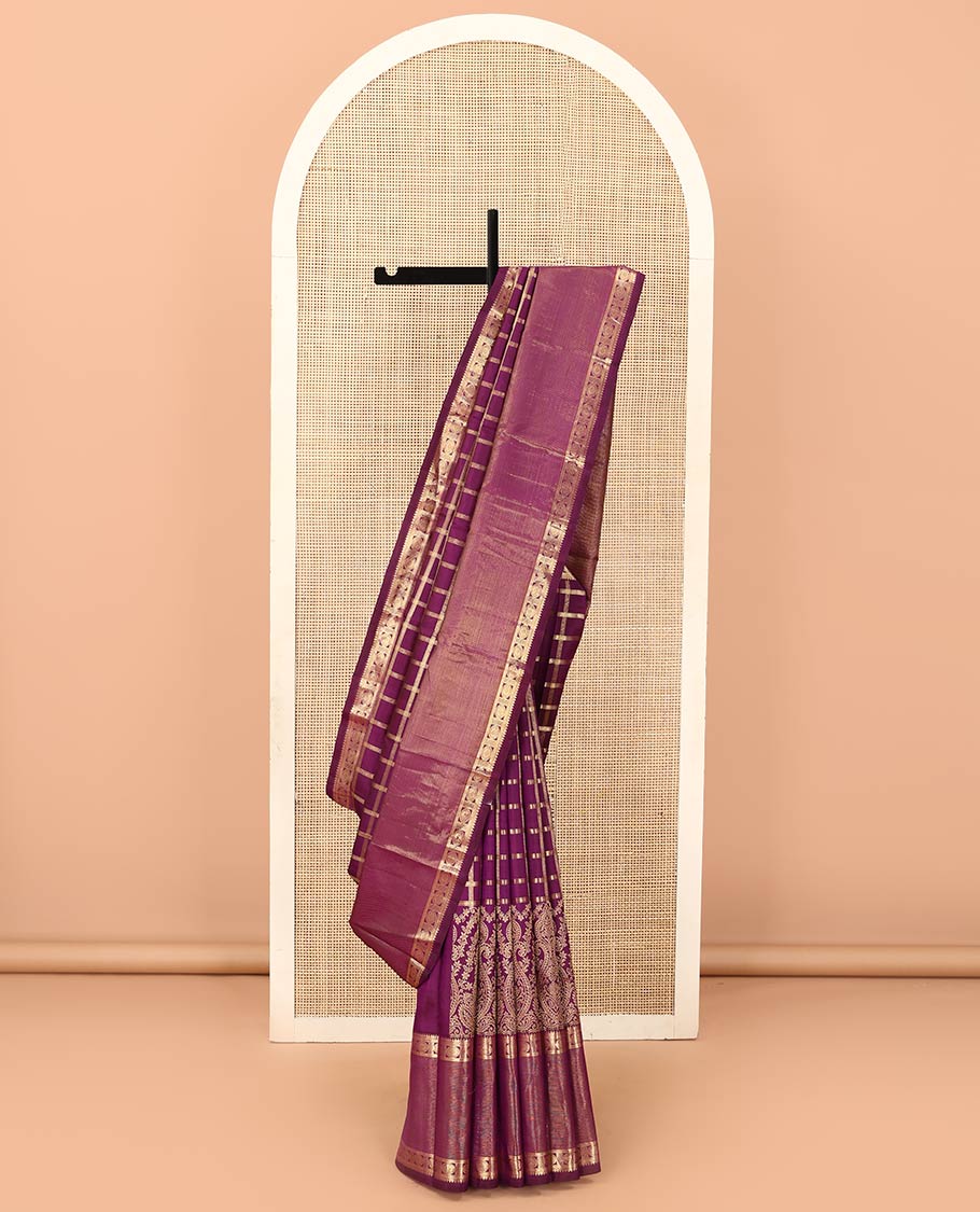 Purple thick zari checked with Mughal buttas designer saree, rettai pettu border of thilakam mokku, muthu, and chakram designs, and mayil kann design pallu