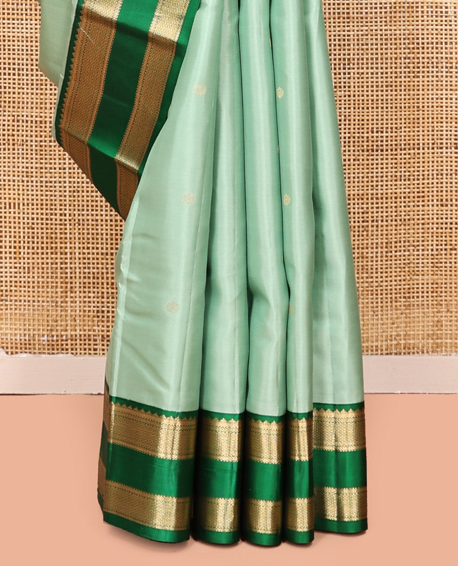 Green Kanchipuram Silk Saree, Woven with Zari Buttas, Contrast Korvai Rettai Pettu Border of Rekku, Kathir, and Mayil Kann Designs, Pallu of Jaal Design, and a Contrast Blouse