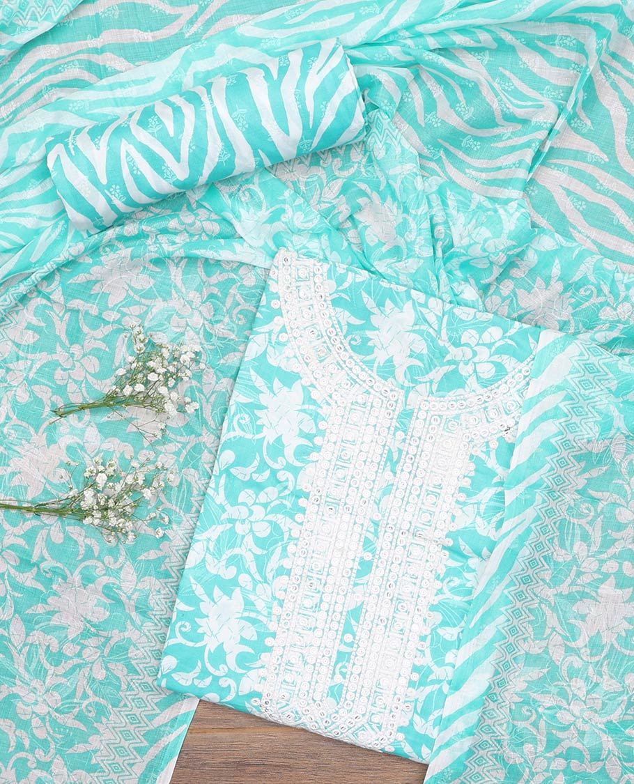 Turquoise cotton material churidar set, floral printed with neck embroidered top, tiger skin style printed bottom, and dupatta of floral and animal print