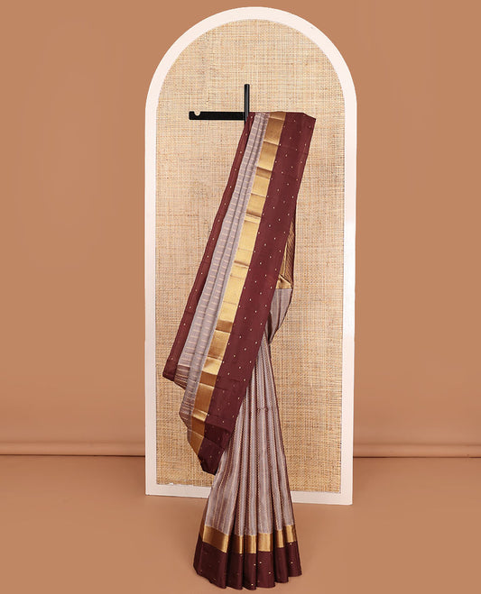 Grey Vasundhara Lite-Silk Mix Saree Enriched with Zig-Zag Zari Stripes, Complemented with a Contrast Border Featuring Rekku, Muthu, and Mayil Kann Design, Opulently Embellished Pallu of Jaal Design, and a Contrast Blouse