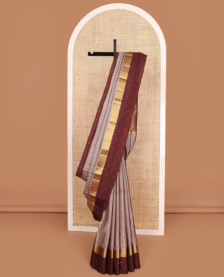 Grey Vasundhara Lite-Silk Mix Saree Enriched with Zig-Zag Zari Stripes, Complemented with a Contrast Border Featuring Rekku, Muthu, and Mayil Kann Design, Opulently Embellished Pallu of Jaal Design, and a Contrast Blouse