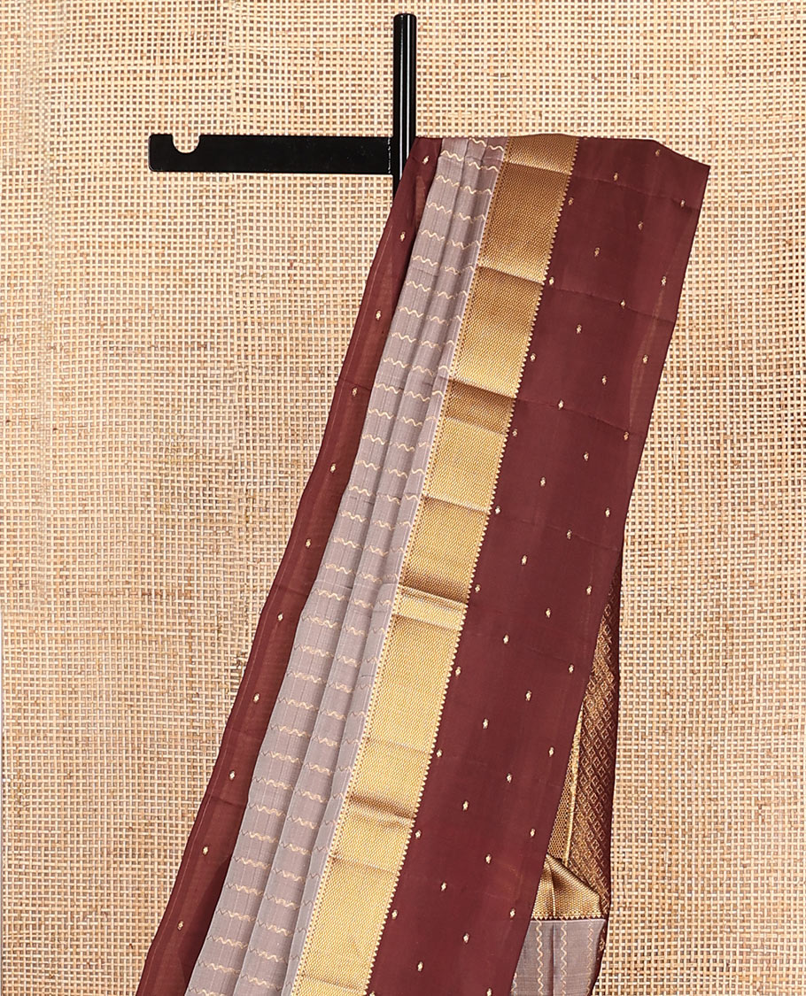 Grey Vasundhara Lite-Silk Mix Saree Enriched with Zig-Zag Zari Stripes, Complemented with a Contrast Border Featuring Rekku, Muthu, and Mayil Kann Design, Opulently Embellished Pallu of Jaal Design, and a Contrast Blouse