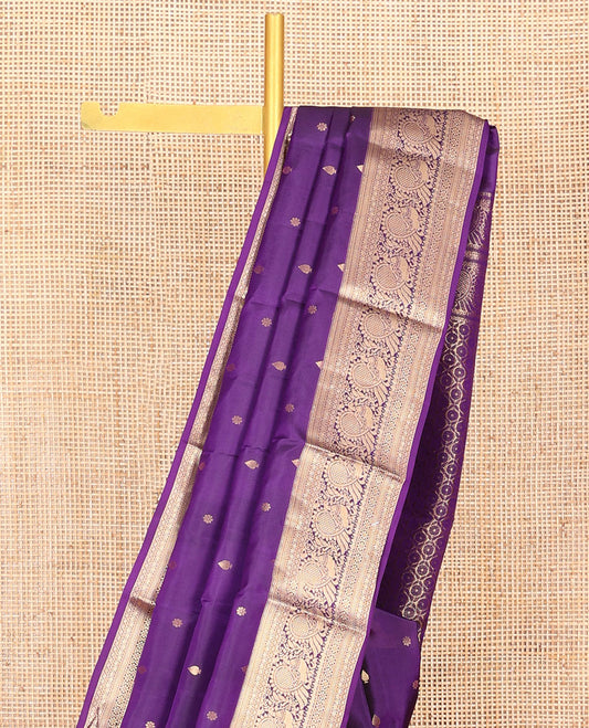 Violet Vasundhara Silk Saree Graced with Zari Buttas All Over Its Body, Highlighted by a Zari Border of Kathir, Mayil, Kann, Thilakam, Mayil, and Kamalam Designs, Grand Pallu of Geometric Patterns, and Paired with a Matching Blouse