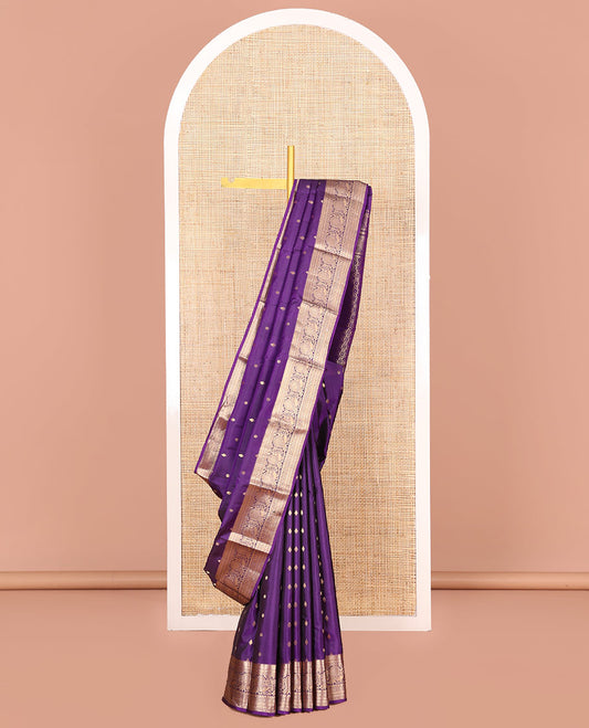 Violet Vasundhara Silk Saree Graced with Zari Buttas All Over Its Body, Highlighted by a Zari Border of Kathir, Mayil, Kann, Thilakam, Mayil, and Kamalam Designs, Grand Pallu of Geometric Patterns, and Paired with a Matching Blouse