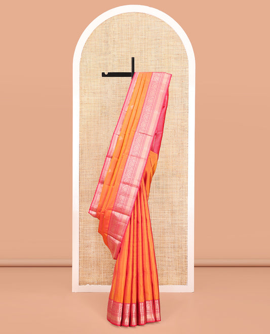 Orange Vasundhara Silk Saree, Sparsely Sparkled with Zari Buttas All Over Its Body, Complemented by a Contrast Border of Rekku, Muthu, Kili, Banaras, Neli, and Mayil Kann Designs, Grand Pallu, and Paired with a Contrast Blouse