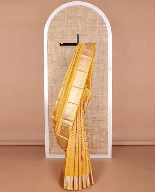 Yellow buttas kancheepuram silk saree with self border of intricate zari design border & floral design pallu