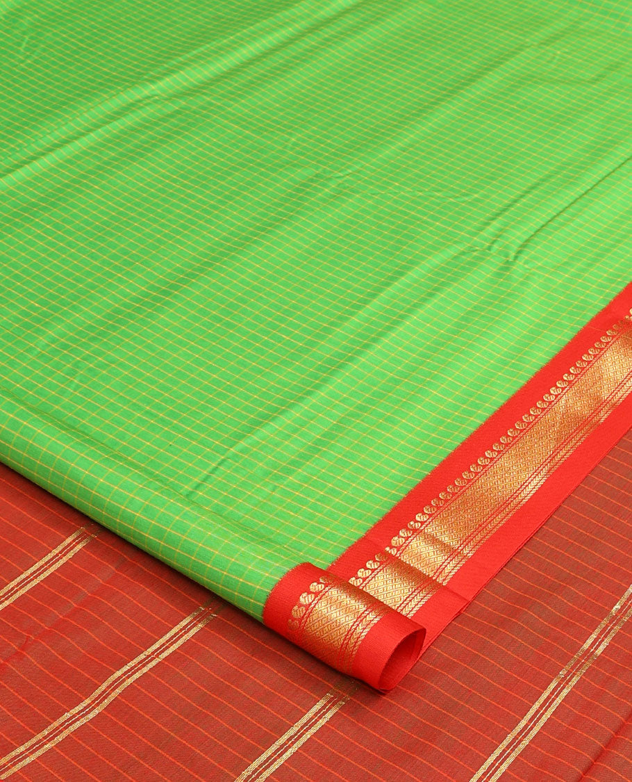 Green checked nine-yard cotton saree, contrast traditional design border, and zari striped pallu