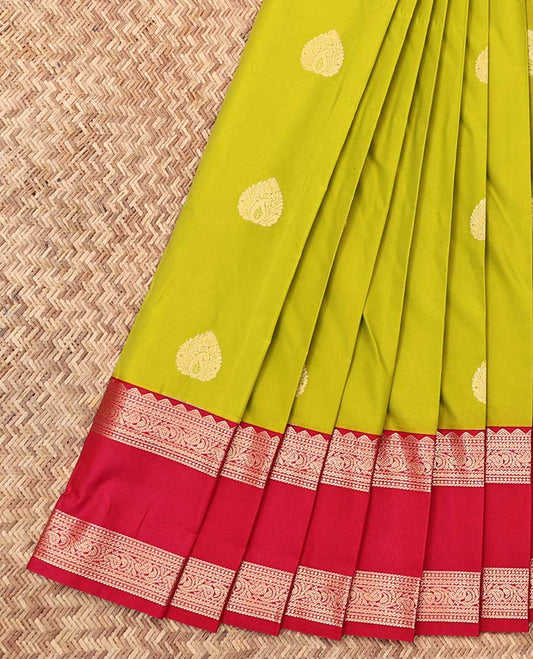 Parrot Green Budget Silk Saree, Gleamed Up with Zari Buttas, a Contrast Traditional Zari Design Rettai Pettu Border, Grand Pallu, and a Contrast Blouse