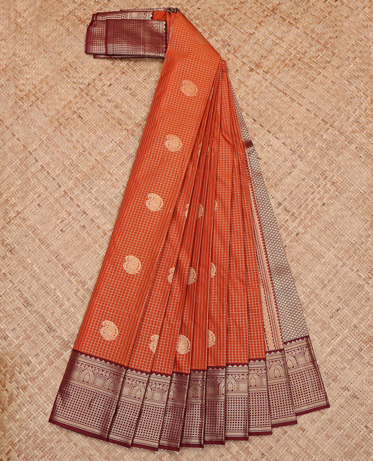 Orange Budget Silk Saree, Steeped in Richness of Paisley Buttas and Zari Checks All Over Its Body, Complemented by a Contrast Traditional Border, Jaal Pallu, and Paired with a Contrast Blouse