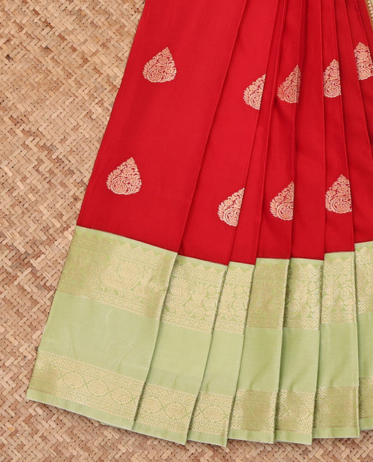 Red Budget Silk Saree, Richly Detailed with Zari Buttas All Over Its Body, Complemented by a Contrast Traditional Zari Design Rettai Pettu Border, Gleaming Zari-Woven Jaal Pallu, and Paired with a Contrast Blouse