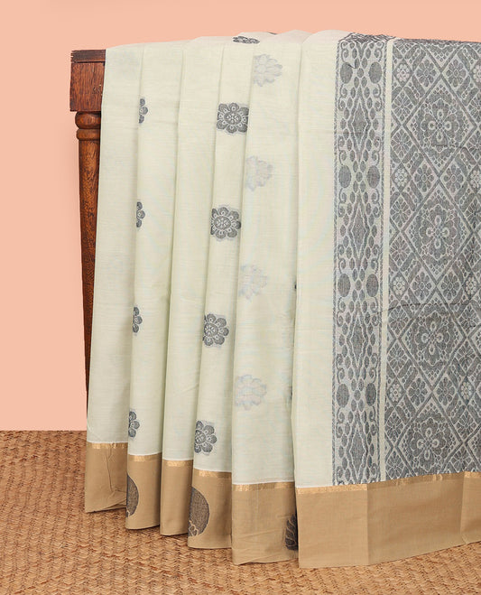 Off-White Kanchi Cotton Saree, Subtly Sparkled with Flower Buttas All Over Its Body, Complemented by Contrast Border of Unique Designs, Pallu Depicts Jaal Design, and Paired with a Matching Blouse