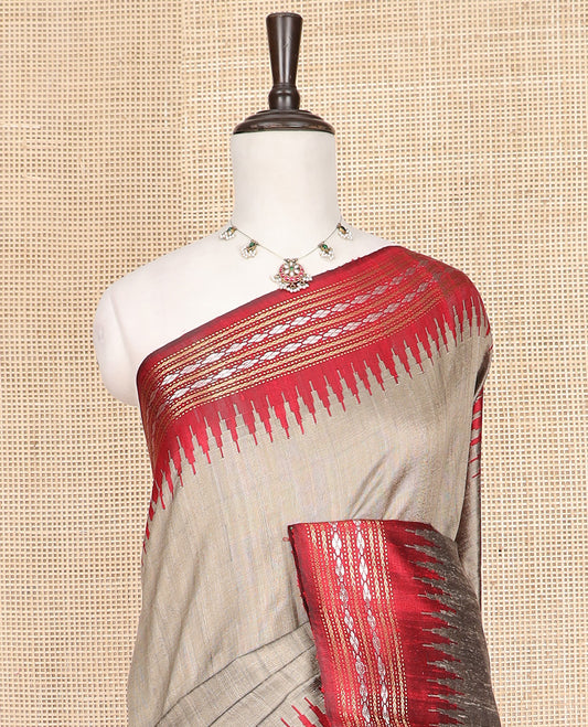 Grey Plain Dupion Silk Saree, Captivating Contrast Temple Border of Geometric Thread Designs, Pallu of Ikkat-Style Floral Designs, and Paired with a Contrast Blouse