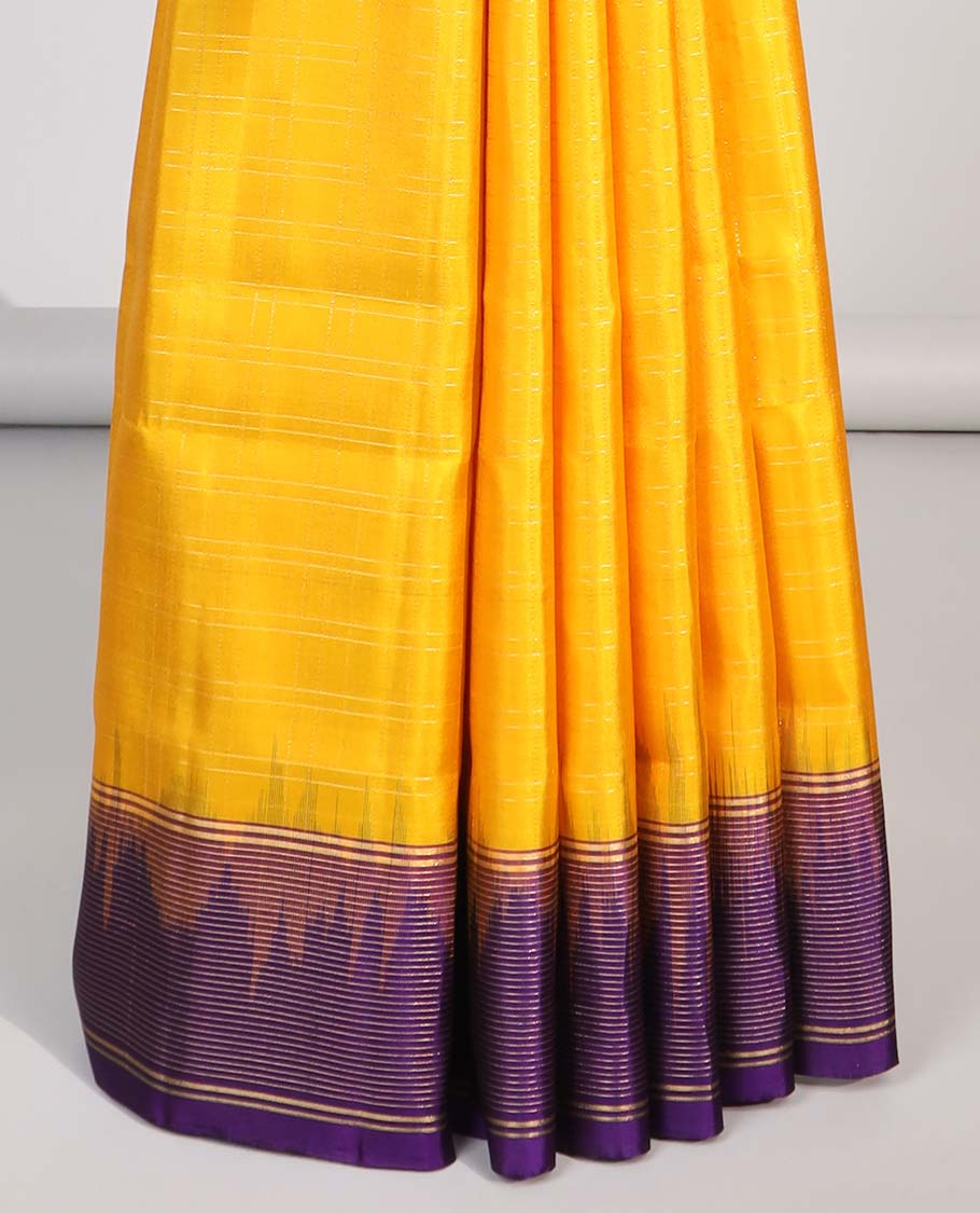 Yellow soft silk saree with contrast striped zari border & intricate zari design pallu