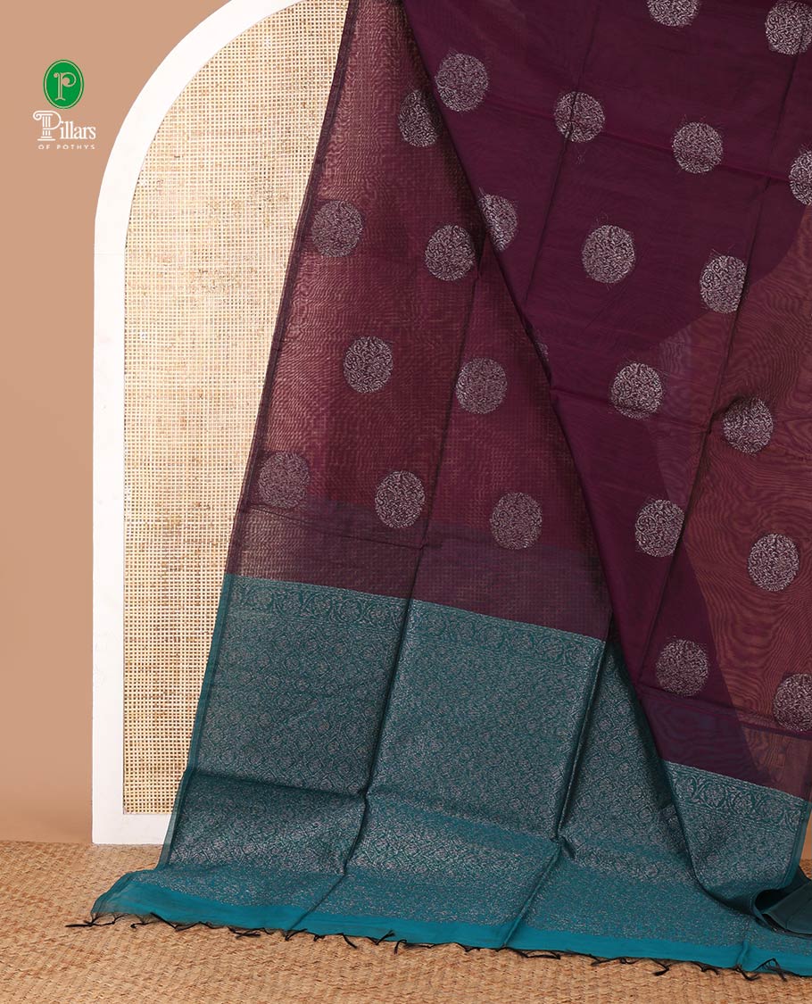 Borderless purple silk cotton saree with circular-shaped zari buttas, contrast pallu of floral creeper & jaal design