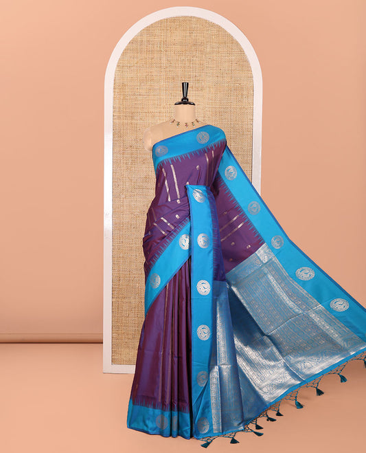 Violet Elite Soft Silk Saree, Enriched with Zari Buttas and Zari Stripes All Over Its Body, Complemented by a Contrast Temple Border of Round Peacock Designs, Rich Pallu of Peacock Chakram Butta Enclosed Checks, and Paired with a Contrast Blouse