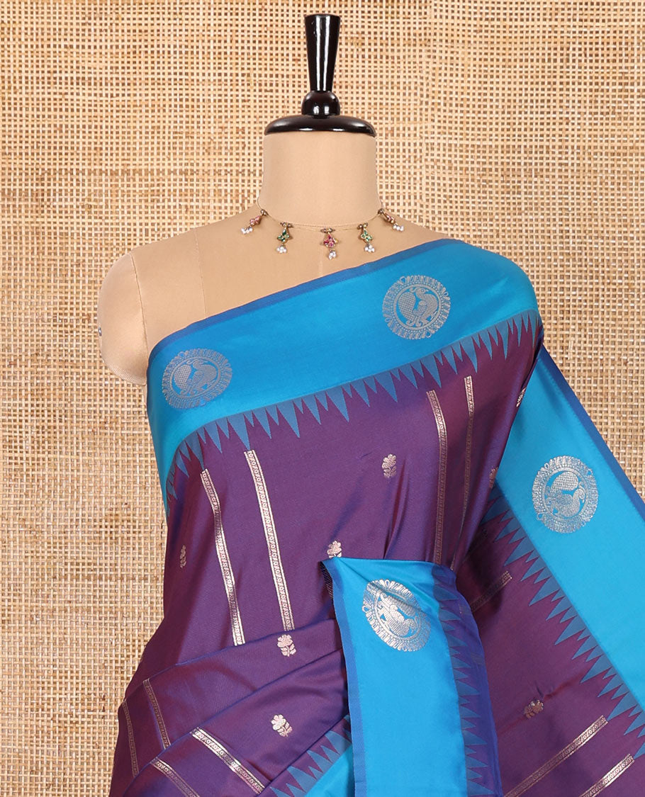 Violet Elite Soft Silk Saree, Enriched with Zari Buttas and Zari Stripes All Over Its Body, Complemented by a Contrast Temple Border of Round Peacock Designs, Rich Pallu of Peacock Chakram Butta Enclosed Checks, and Paired with a Contrast Blouse