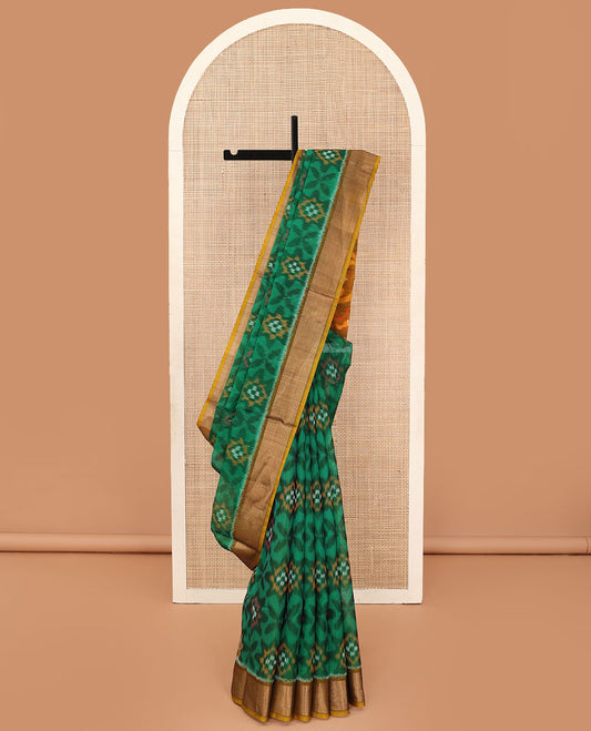 Green ikkat floral patterned silk cotton saree, contrast bavanji border, and pallu of ikkat Mughal style design weave