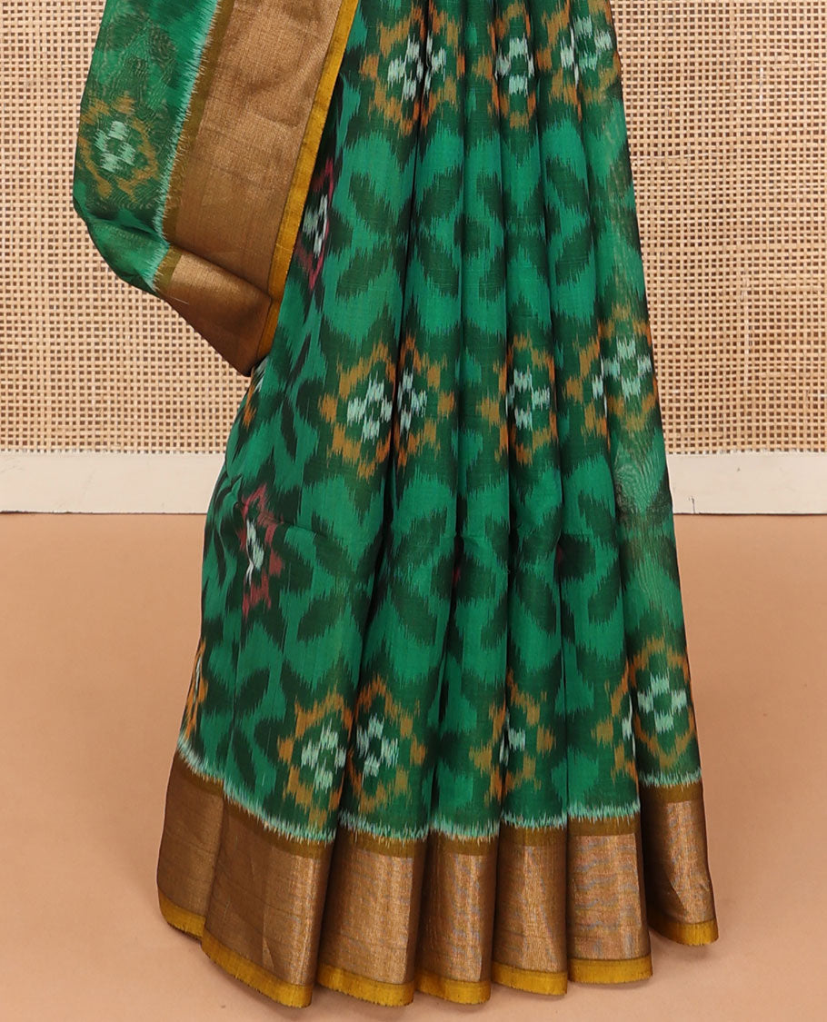 Green ikkat floral patterned silk cotton saree, contrast bavanji border, and pallu of ikkat Mughal style design weave