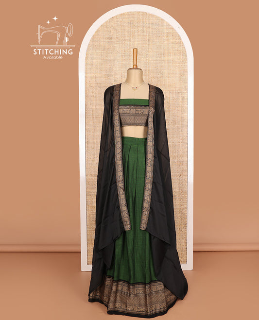 Green cotton half-saree, plain with contrast traditional motifs bordered skirt, matching blouse, and contrast elephant motif dhavani