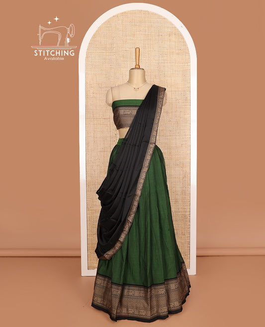 Green cotton half-saree, plain with contrast traditional motifs bordered skirt, matching blouse, and contrast elephant motif dhavani