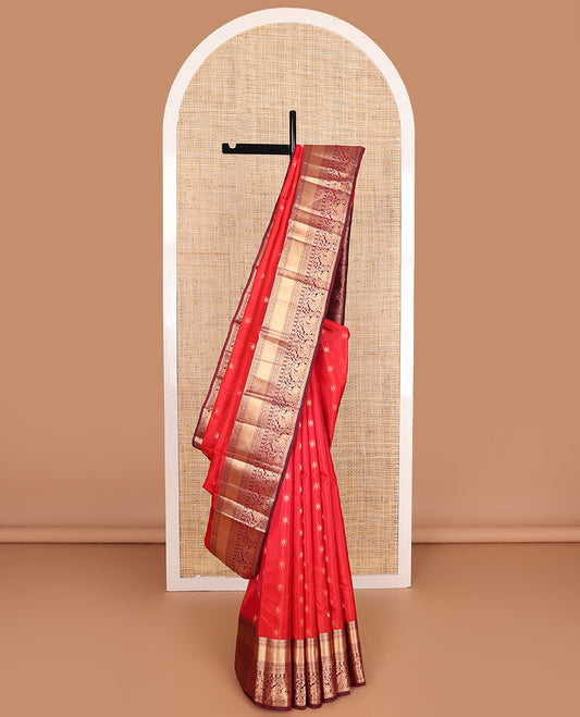 Red zari buttas Vasundhara silk mix saree, contrast border of rekku, laddu kamalam, kuyil kann, rettai neli, poun, and mayil, and intricate pallu