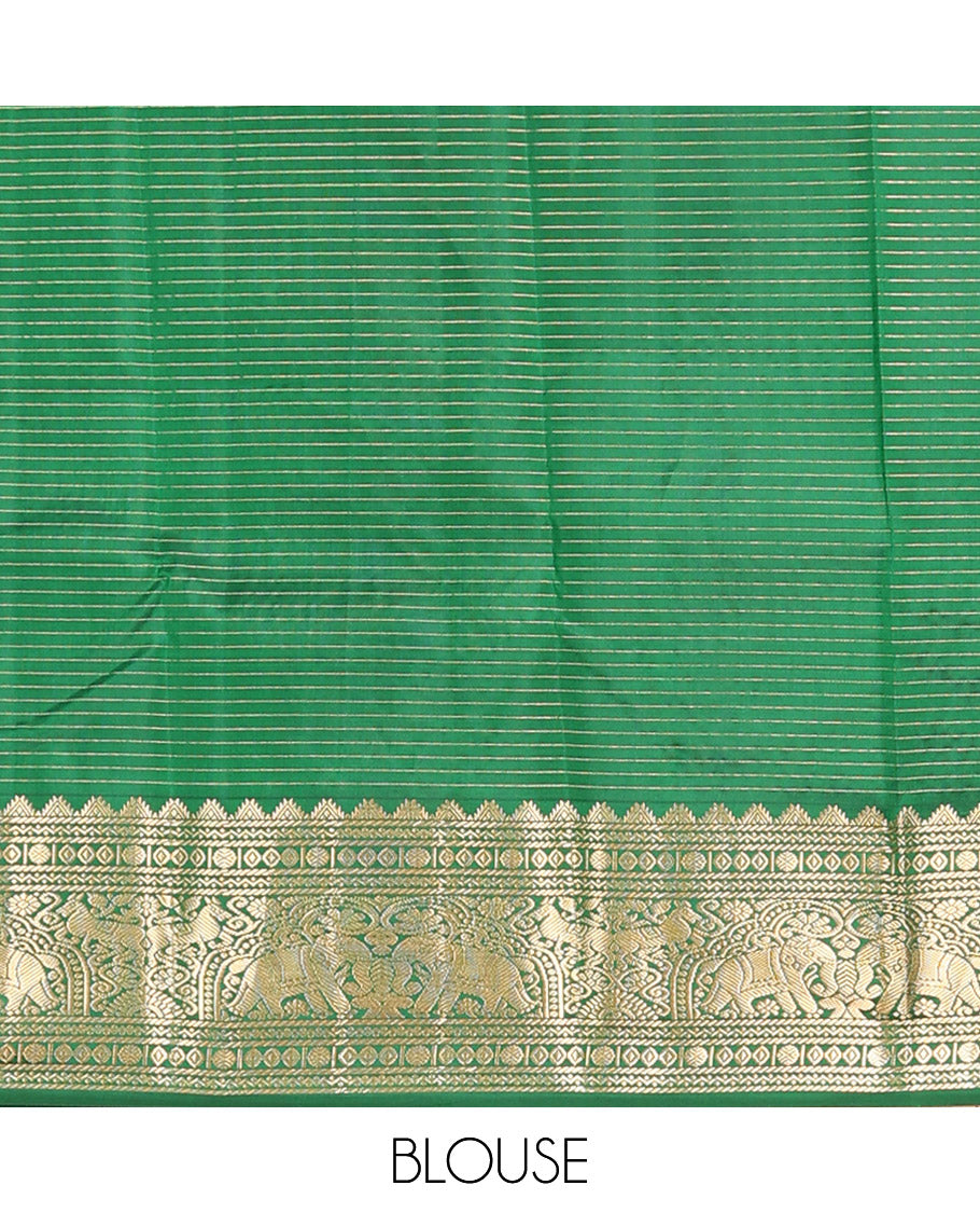 Green Vasundhara Silk Saree Gleamed Up with Zari Checks and Annam Chakram Buttas, Complemented by a Zari Border of Thazampoo Rekku, Neli, Rudraksham, Diamond and Yaanai Designs, Zari Embellished Pallu of Jaal Designs, and Paired with a Matching Blouse