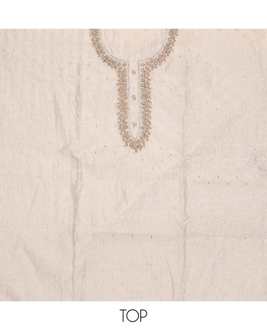 Cream Material Chudidar Set, Subtly Adorned with Sparese Buttas and Embroidery on Tissue Top, a Contrast Santoon Bottom, and Paired with Buttas Steeped Chanderi Silk Dupatta